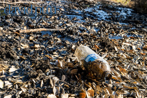 Pretty hilarious, someone sunk into the mud and tar while dipping their water bottle in.